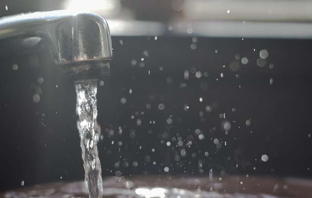 water flowing from kitchen tap